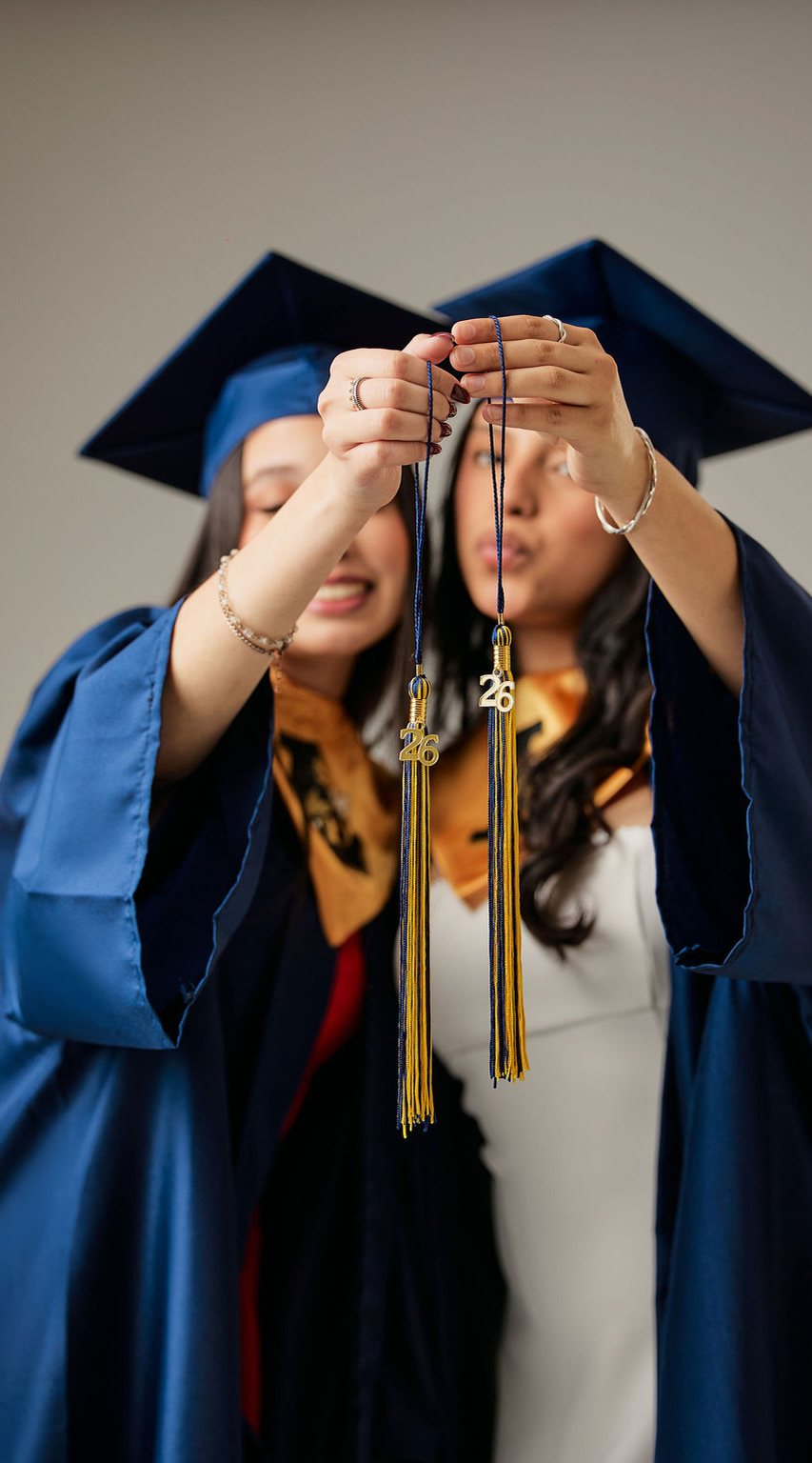 Two graduates with their caps